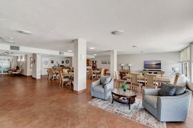 living room with tile patterned floors