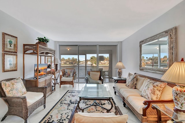 living room featuring floor to ceiling windows, light tile patterned floors, and a wealth of natural light