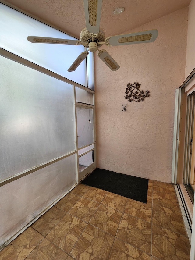 interior space featuring ceiling fan