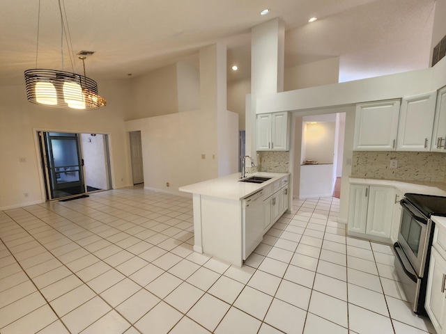 kitchen with dishwasher, sink, tasteful backsplash, stainless steel range with electric stovetop, and white cabinets