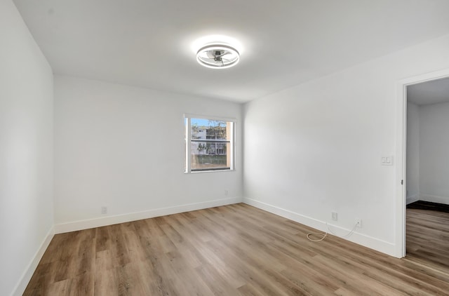 unfurnished room featuring light hardwood / wood-style floors