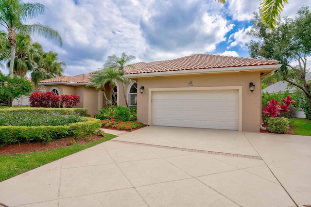 mediterranean / spanish house featuring a garage