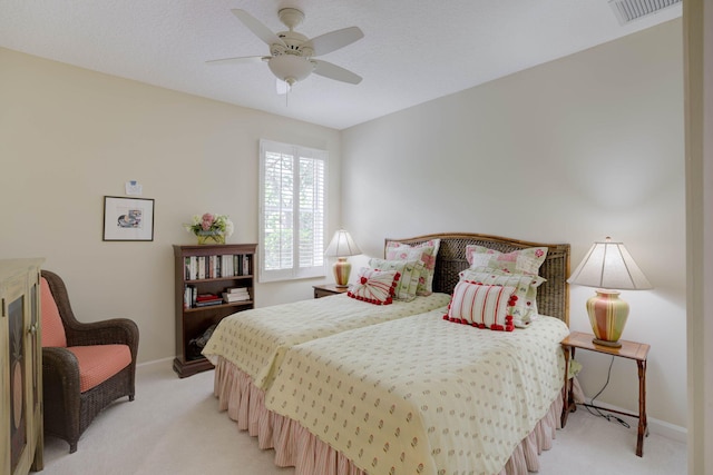 bedroom with ceiling fan and light colored carpet