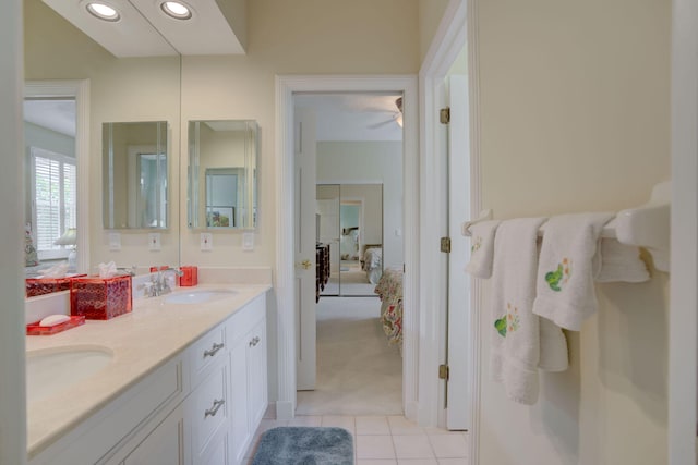 bathroom with tile patterned flooring and vanity