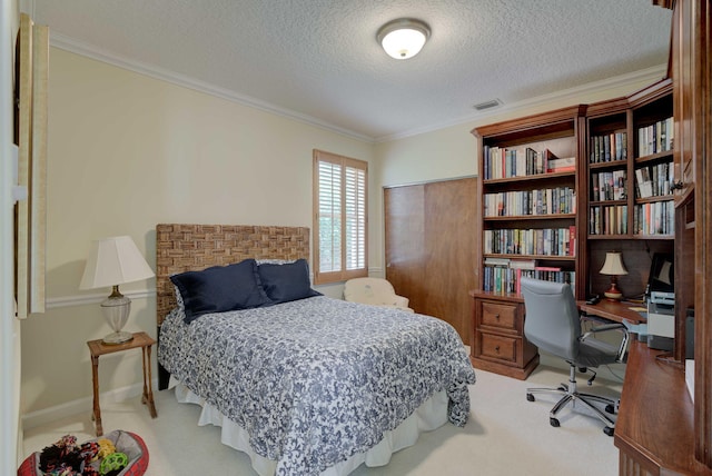 carpeted bedroom featuring crown molding and a textured ceiling