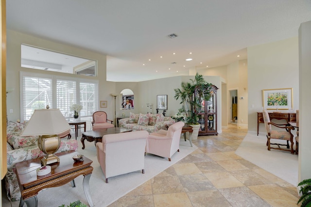 living room with a high ceiling