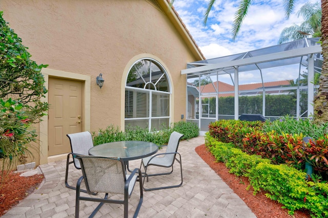 view of patio / terrace with glass enclosure