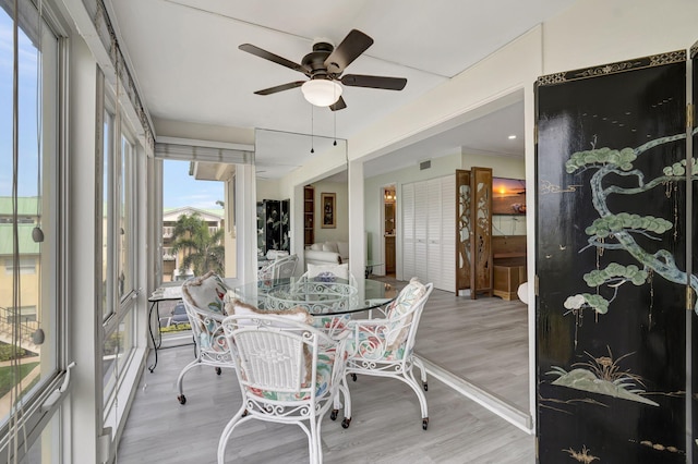 sunroom / solarium with ceiling fan