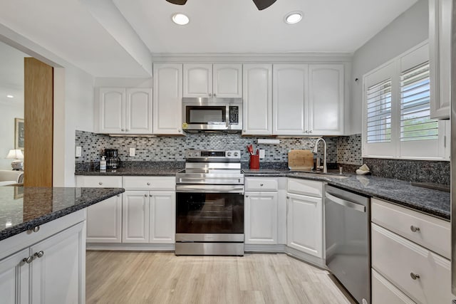 kitchen featuring white cabinetry and stainless steel appliances