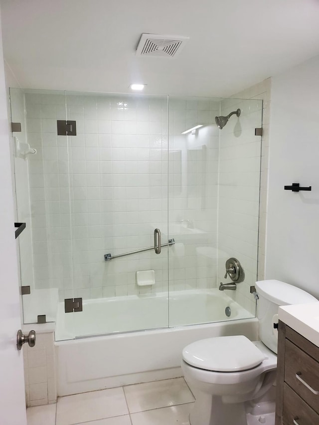 full bathroom featuring tile patterned flooring, vanity, toilet, and enclosed tub / shower combo