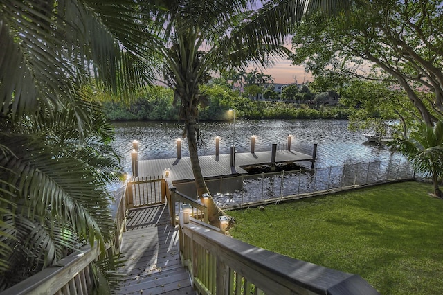 dock area featuring a yard and a water view