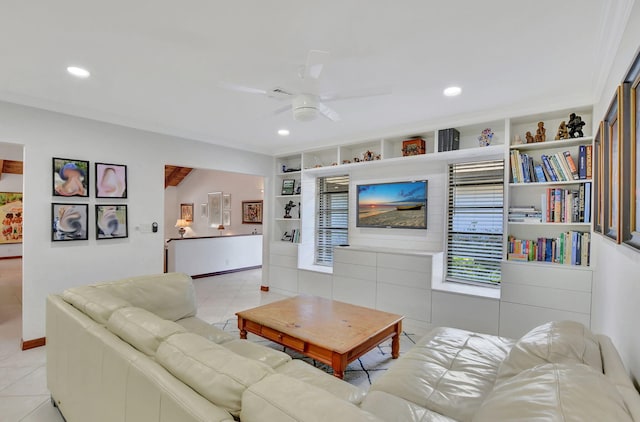 living room with built in shelves, ceiling fan, and light tile patterned flooring