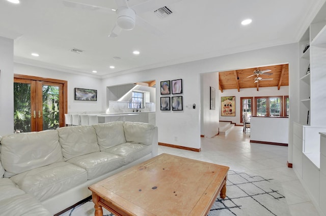 tiled living room featuring french doors, a wealth of natural light, ceiling fan, and wood ceiling