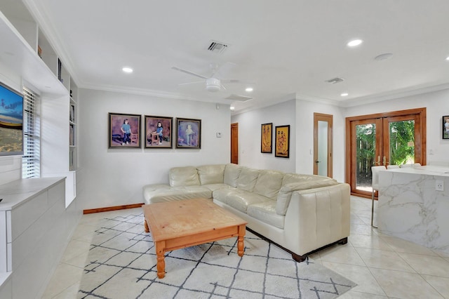 tiled living room featuring ceiling fan, built in features, ornamental molding, and french doors