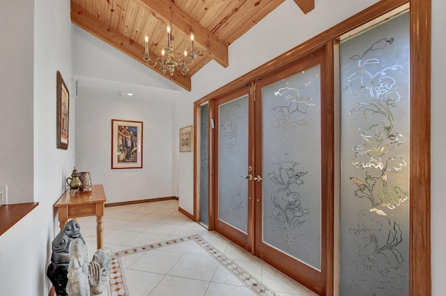 entrance foyer with wooden ceiling, french doors, lofted ceiling with beams, light tile patterned floors, and a chandelier