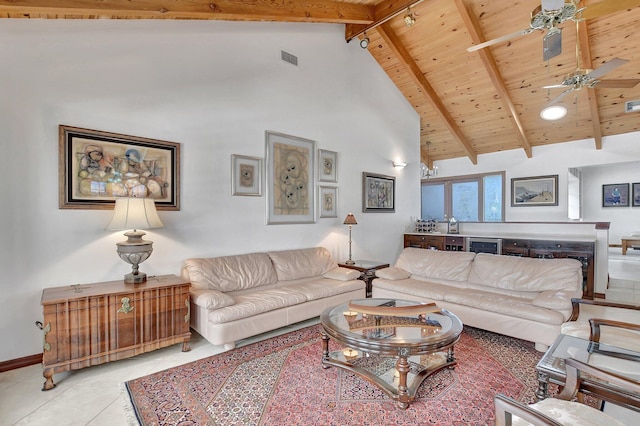 tiled living room with ceiling fan, beamed ceiling, high vaulted ceiling, a fireplace, and wood ceiling