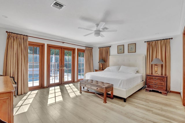 bedroom with access to exterior, ceiling fan, french doors, crown molding, and light hardwood / wood-style floors