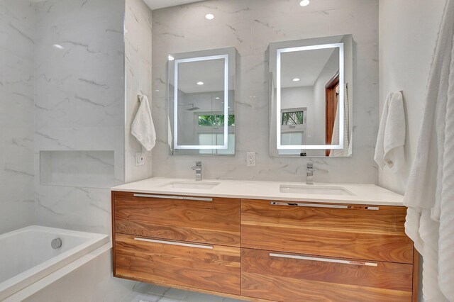 bathroom featuring vanity and a bathtub