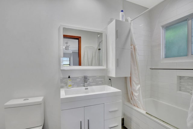 full bathroom with vanity, toilet, shower / bathtub combination with curtain, and decorative backsplash