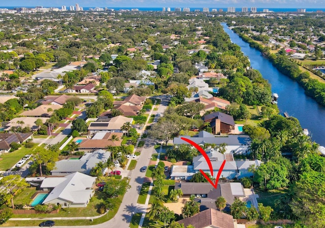 birds eye view of property with a water view