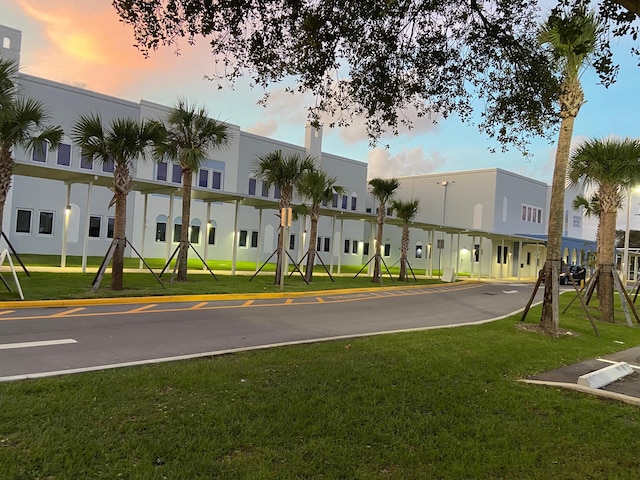 view of outdoor building at dusk