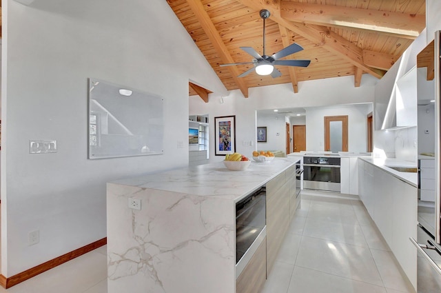 kitchen featuring light stone countertops, wooden ceiling, lofted ceiling with beams, oven, and light tile patterned floors