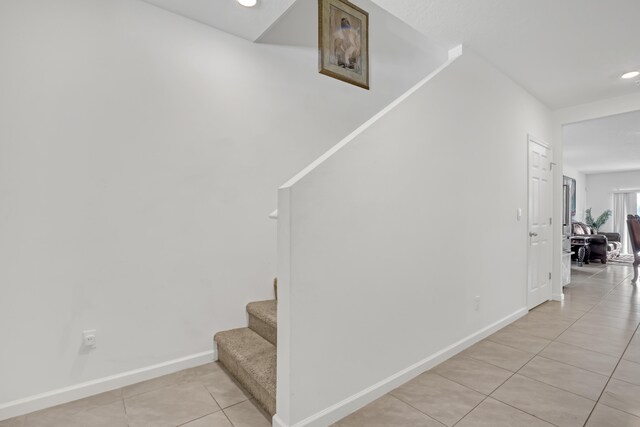 stairs with tile patterned flooring