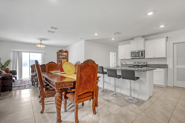 dining space with light tile patterned floors