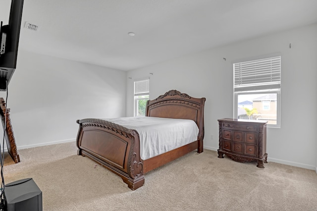 bedroom with light carpet