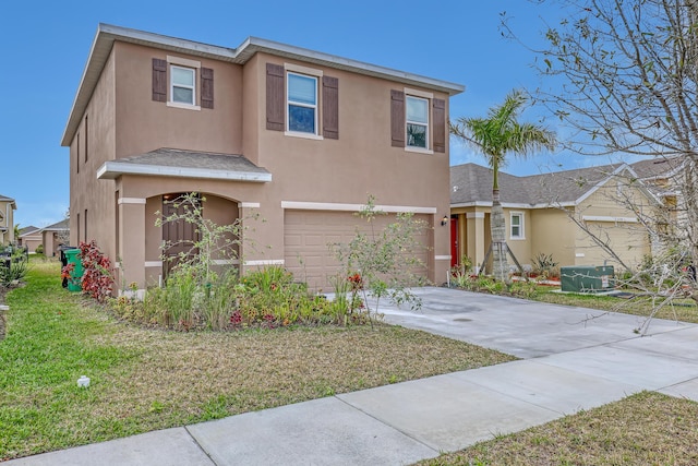 view of front of house with a garage and a front yard