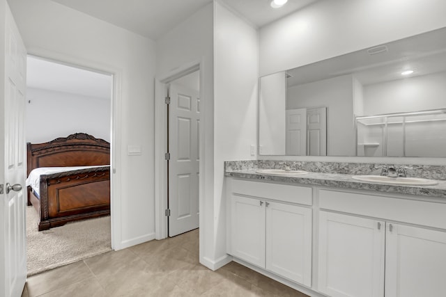 bathroom featuring vanity and tile patterned flooring