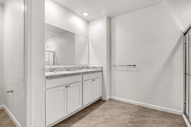 bathroom featuring vanity and tile patterned flooring