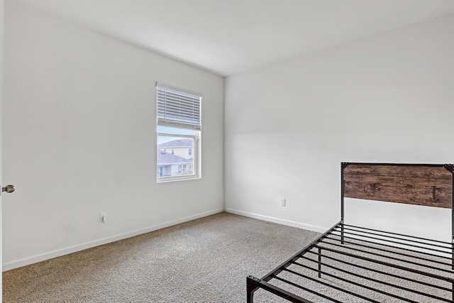 unfurnished bedroom with carpet flooring