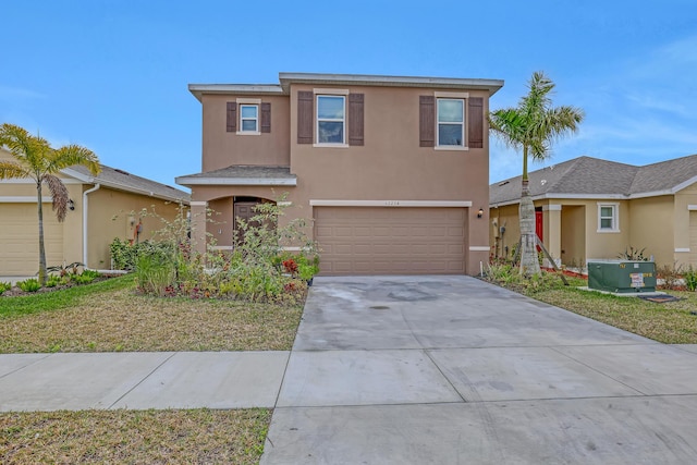 front of property with a garage and central AC unit