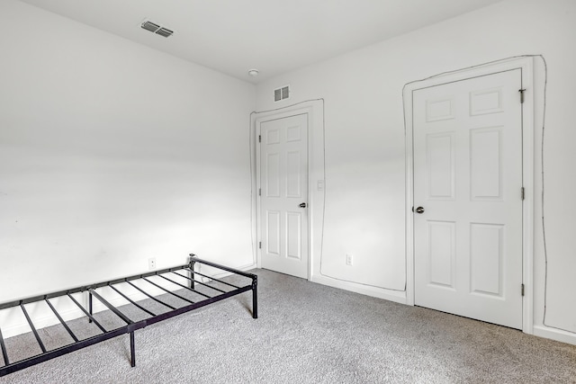 unfurnished bedroom with carpet flooring