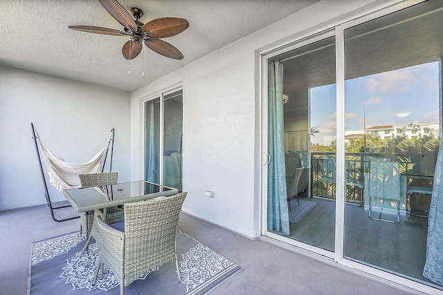 balcony featuring ceiling fan