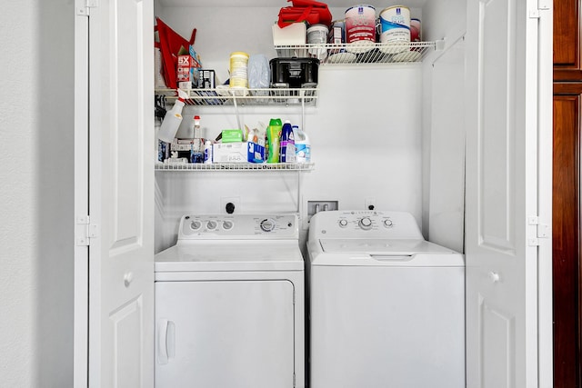 clothes washing area with washer and dryer