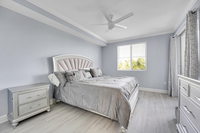 bedroom featuring light wood-type flooring, ceiling fan, and ornamental molding