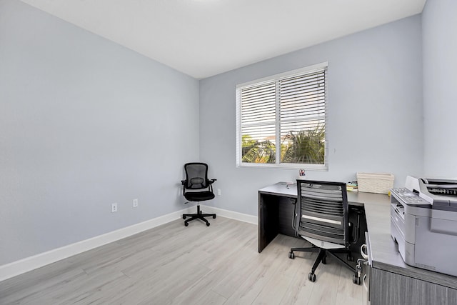 office space with light hardwood / wood-style flooring