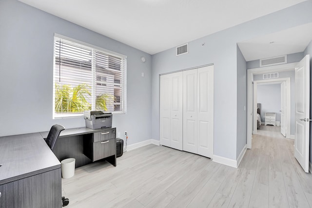 home office featuring light hardwood / wood-style floors