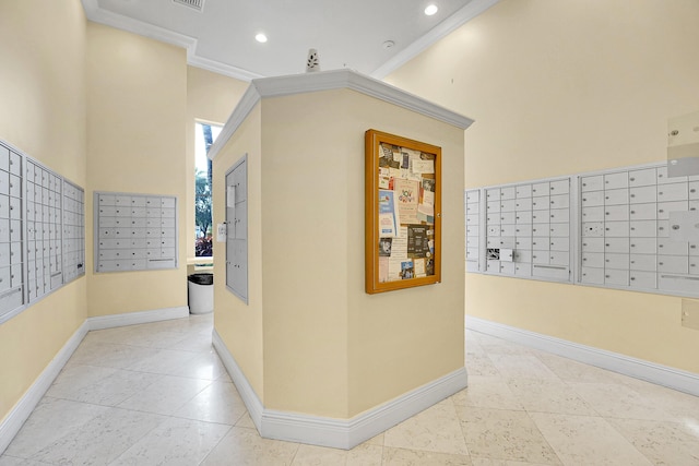 hallway with mail boxes, crown molding, and light tile patterned flooring