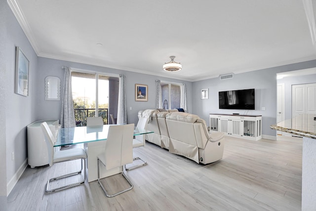 dining space featuring light hardwood / wood-style flooring and ornamental molding