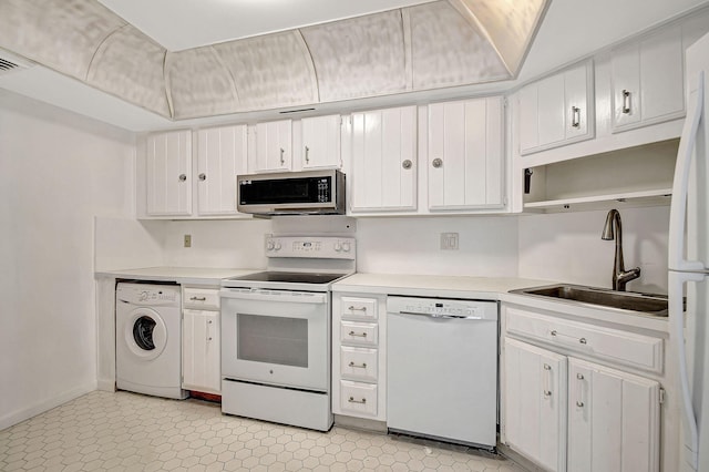 kitchen with white cabinetry, washer / dryer, white appliances, and sink