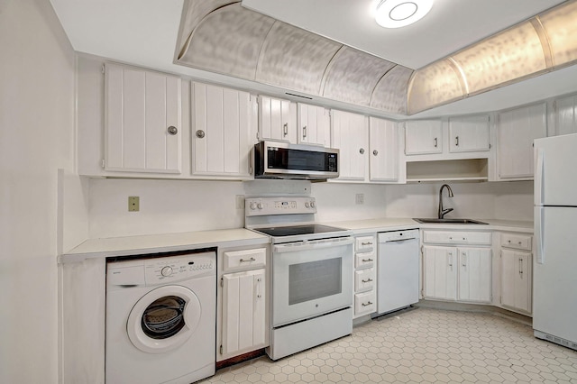 kitchen featuring washer / dryer, white appliances, white cabinetry, and sink