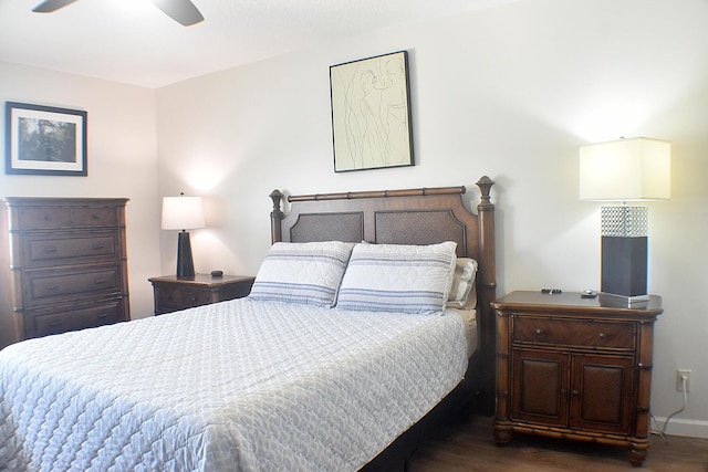 bedroom featuring a ceiling fan, baseboards, and wood finished floors