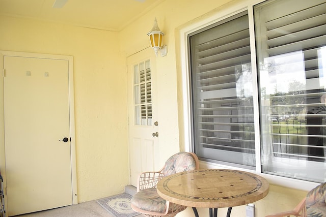 property entrance with stucco siding