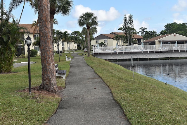 view of property's community featuring a residential view, a water view, and a yard