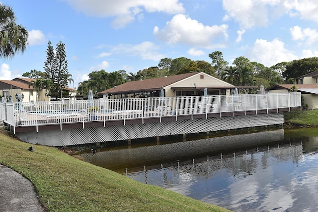 rear view of property with a water view