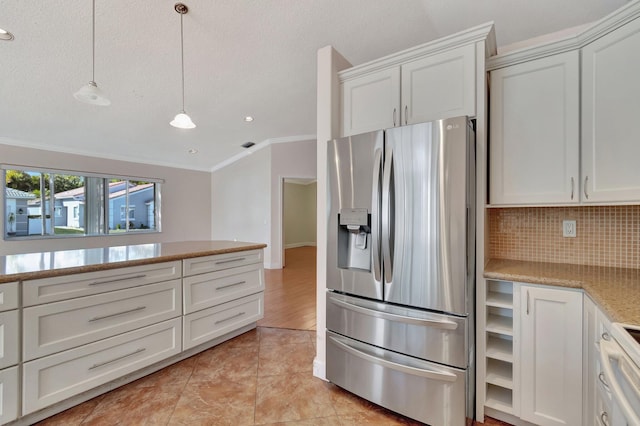 kitchen featuring white cabinets, stainless steel refrigerator with ice dispenser, hanging light fixtures, and white electric range oven