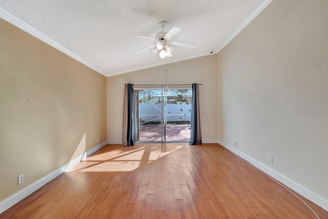 spare room with light wood-type flooring, a textured ceiling, ceiling fan, crown molding, and lofted ceiling